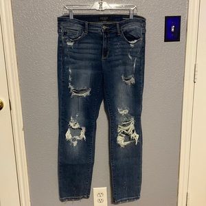 Judy Blue. Super distressed, light bleaching. Boyfriend fit.